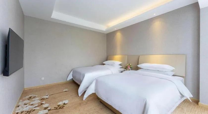 Bed in Vienna Hotel Jiangxi Fuzhou Yihuang