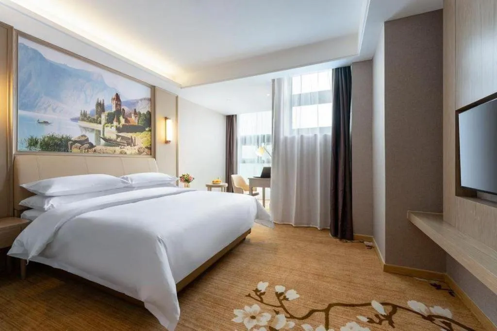 Bed in Vienna Hotel Jiangxi Fuzhou Yihuang