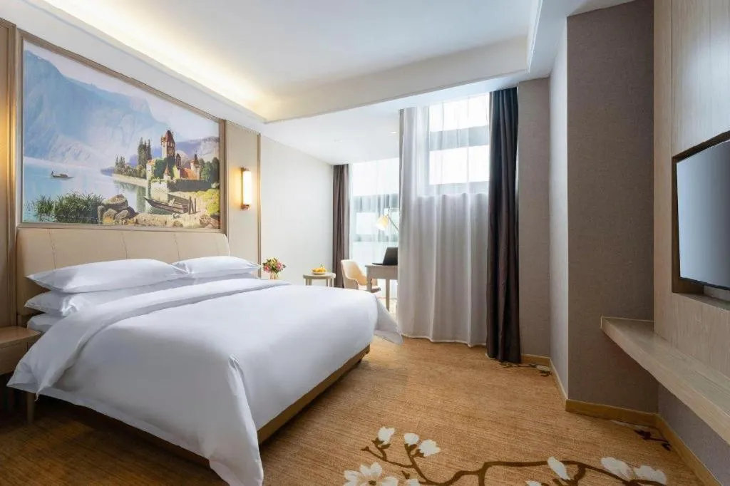 Bed in Vienna Hotel Jiangxi Fuzhou Yihuang