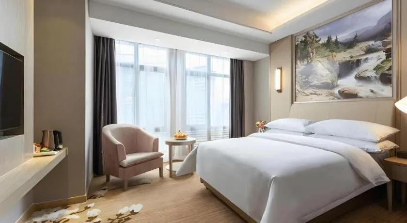 Bed in Vienna Hotel Jiangxi Fuzhou Yihuang