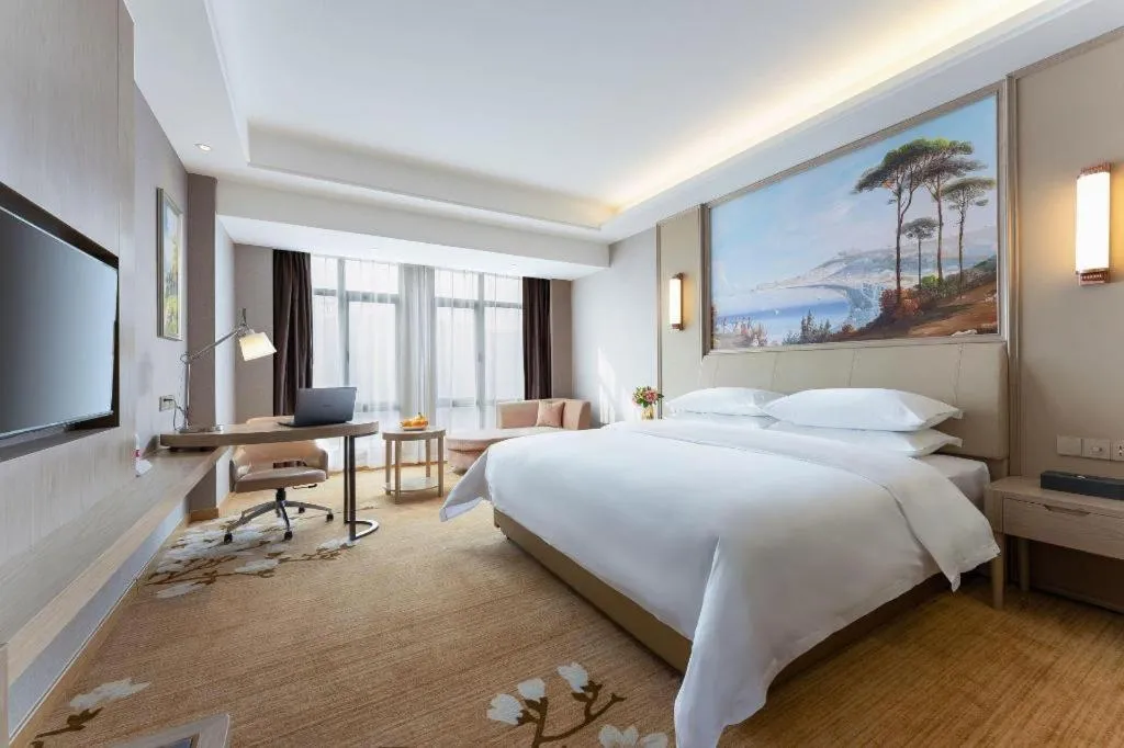 Bed in Vienna Hotel Jiangxi Fuzhou Yihuang
