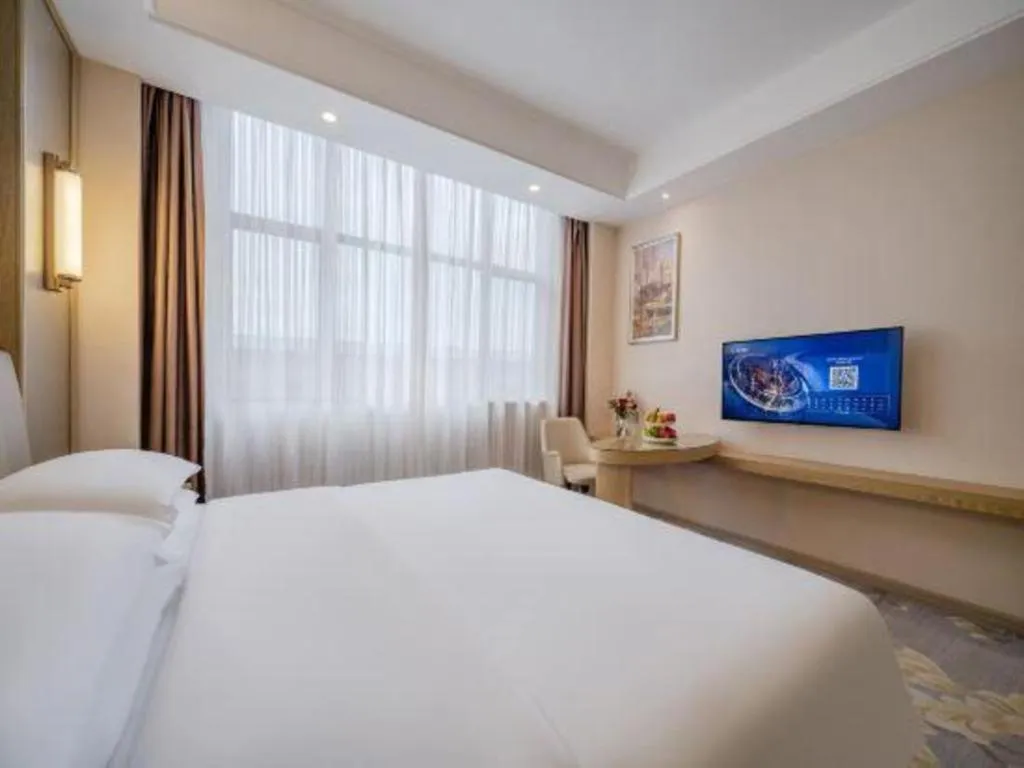 Bed in Vienna Hotel Shenzhen Pingshan Longtian Town