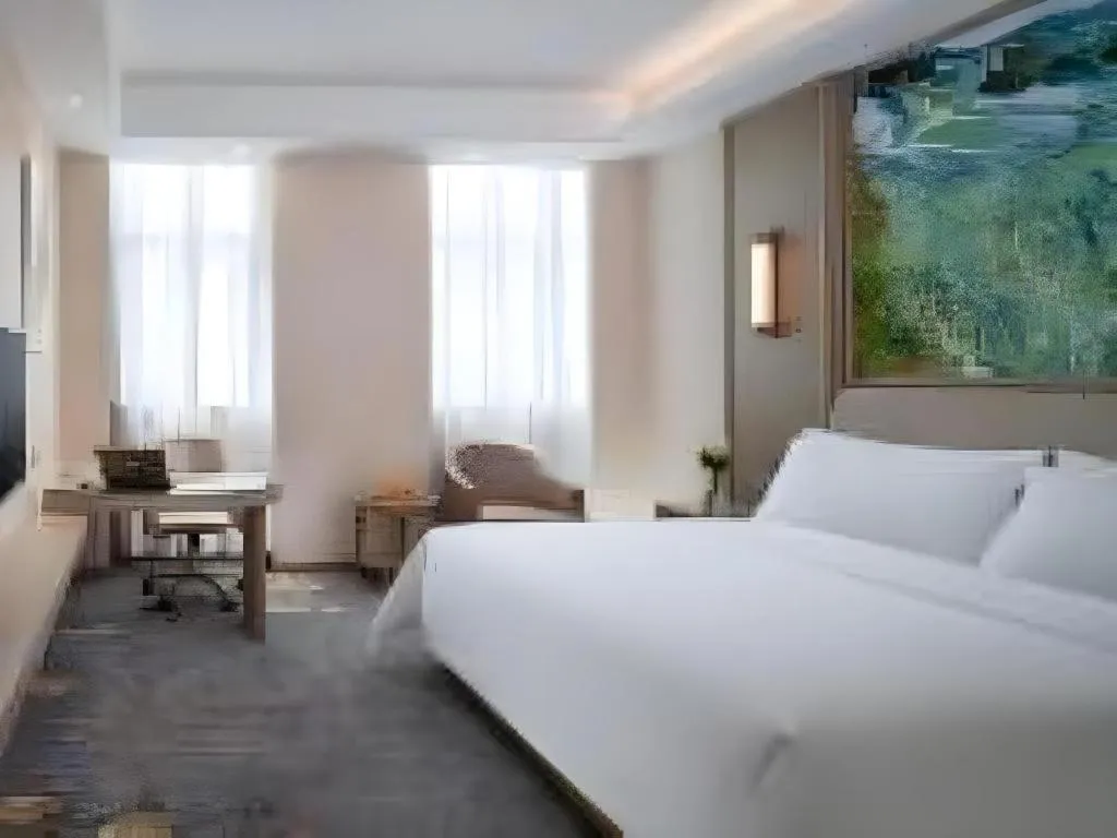 Bed in Vienna Hotel Shenzhen Pingshan Longtian Town