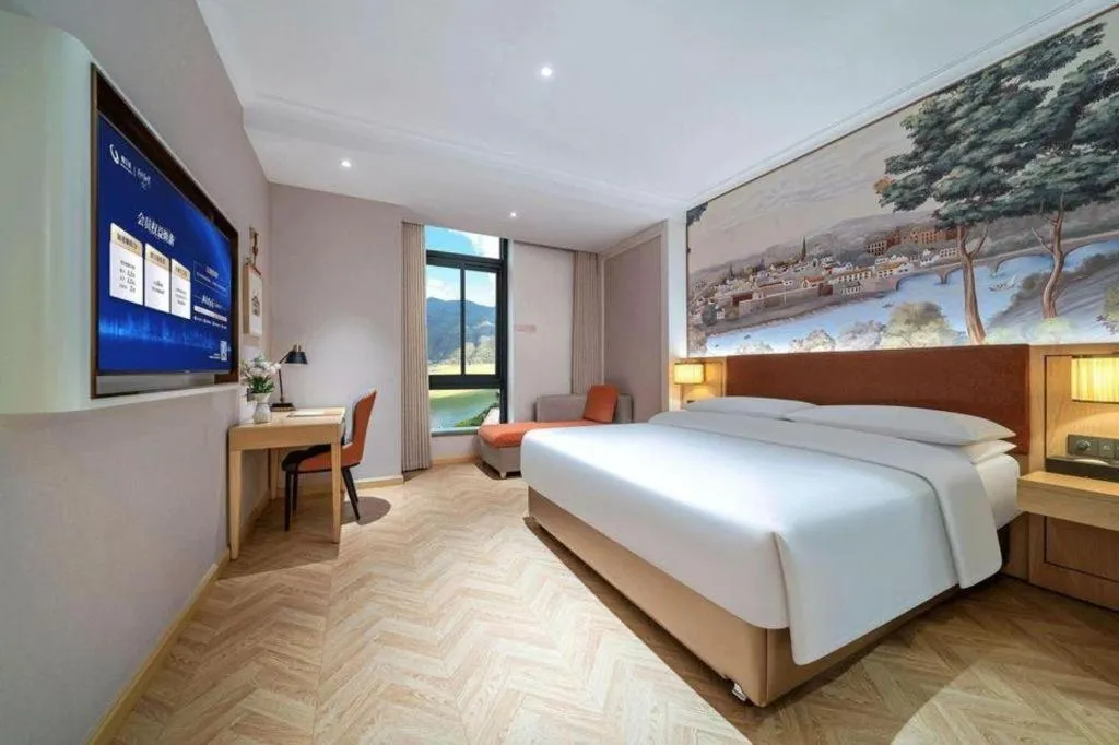 Bed in Vienna Hotel Chongqing Wushan Municipal Government