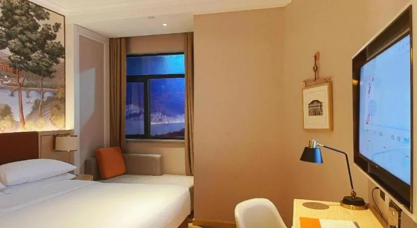 Bed in Vienna Hotel Chongqing Wushan Municipal Government