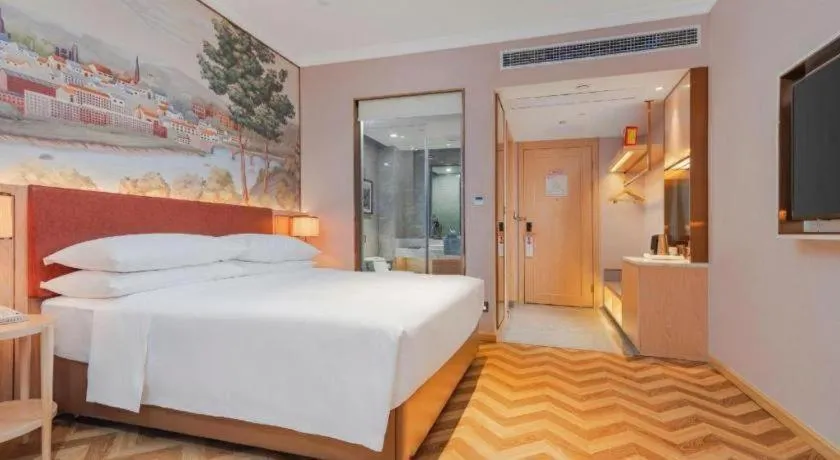 Bed in Vienna Hotel Chongqing Wushan Municipal Government