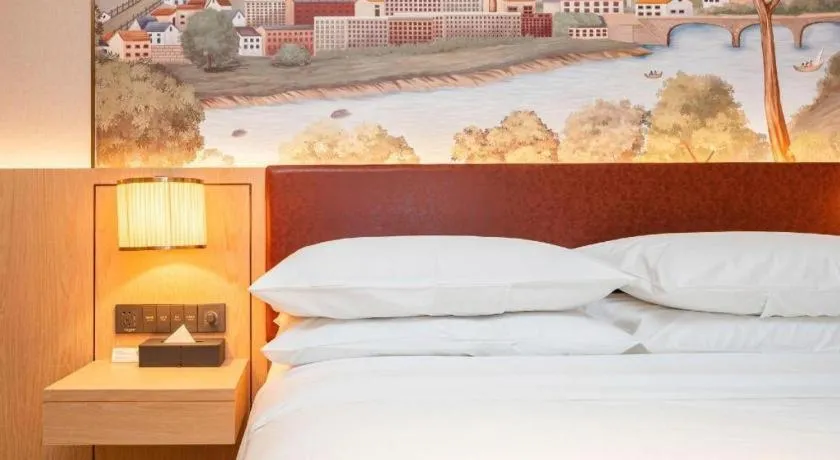 Bed in Vienna Hotel Chongqing Wushan Municipal Government