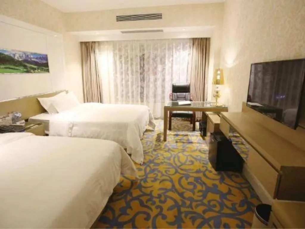 Bed in Vienna Hotel Guangdong Zhuhai Mingzhu Station Guozheng