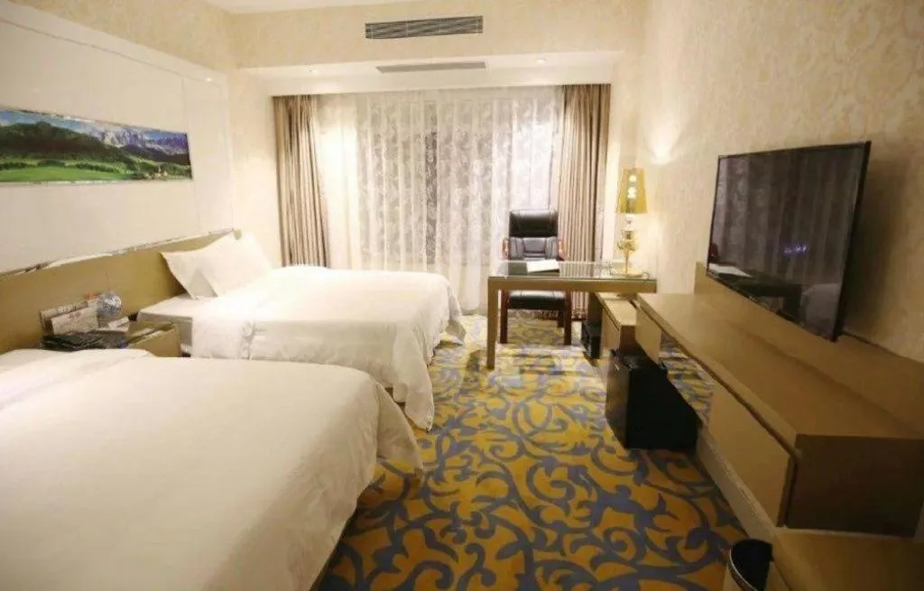 Bed in Vienna Hotel Guangdong Zhuhai Mingzhu Station Guozheng