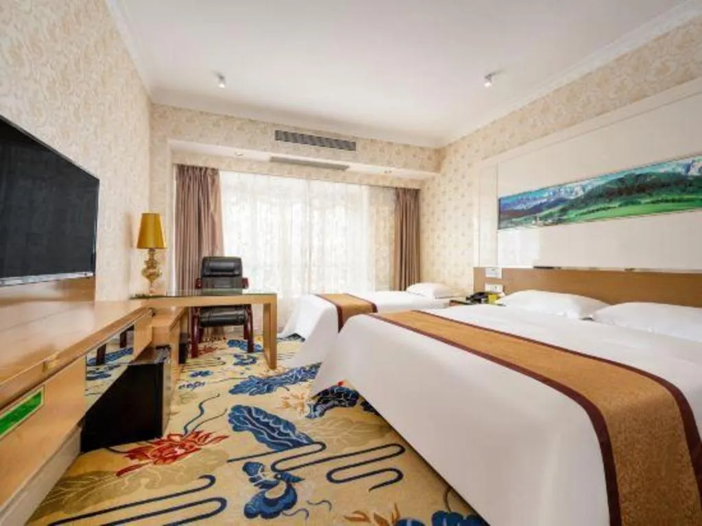 Bed in Vienna Hotel Guangdong Zhuhai Mingzhu Station Guozheng