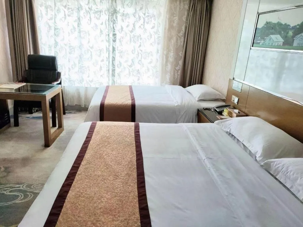 Bed in Vienna Hotel Guangdong Zhuhai Mingzhu Station Guozheng