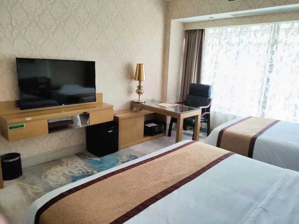 Bed in Vienna Hotel Guangdong Zhuhai Mingzhu Station Guozheng