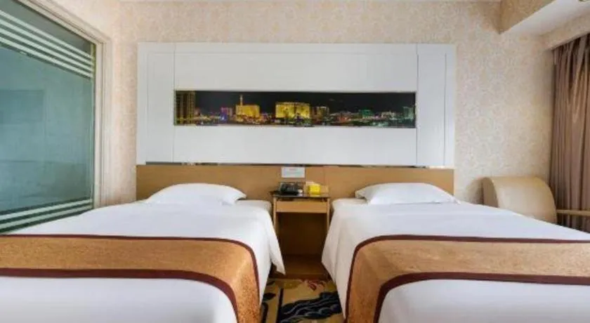 Bed in Vienna Hotel Guangdong Zhuhai Mingzhu Station Guozheng