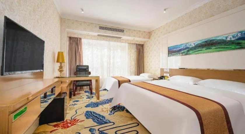 Bed in Vienna Hotel Guangdong Zhuhai Mingzhu Station Guozheng