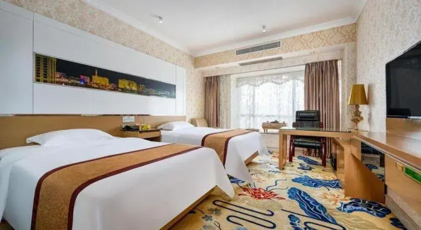 Bed in Vienna Hotel Guangdong Zhuhai Mingzhu Station Guozheng Bed in Vienna Hotel Guangdong Zhuhai Mingzhu Station Guozheng