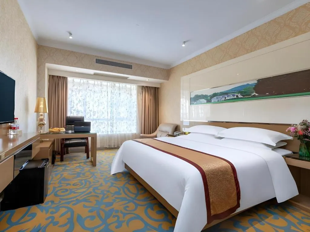 Bed in Vienna Hotel Guangdong Zhuhai Mingzhu Station Guozheng