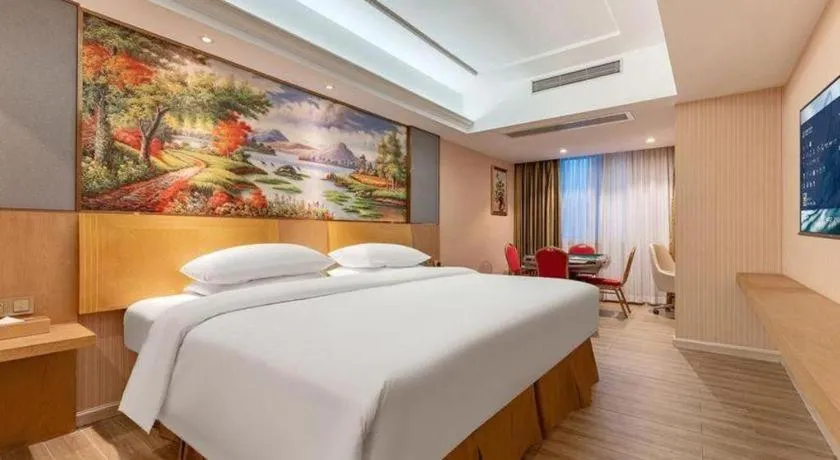 Bed in Vienna Hotel Guangzhou Baiyun Airport Huadu Avenue