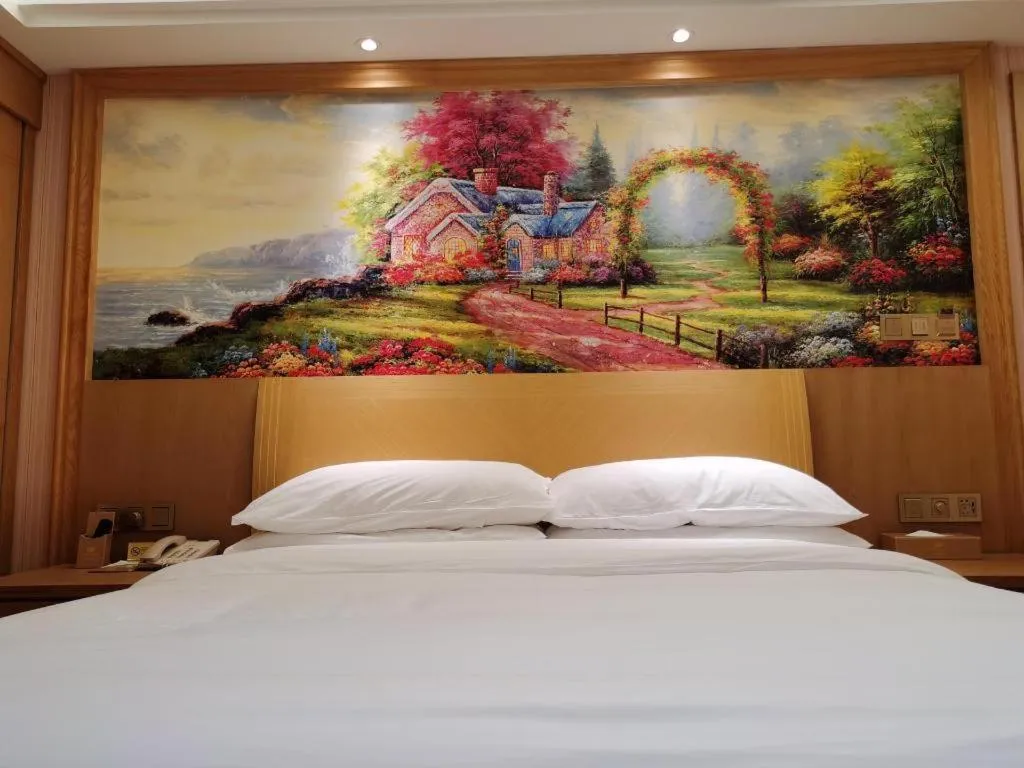 Bed in Vienna Hotel Guangzhou Baiyun Airport Huadu Avenue