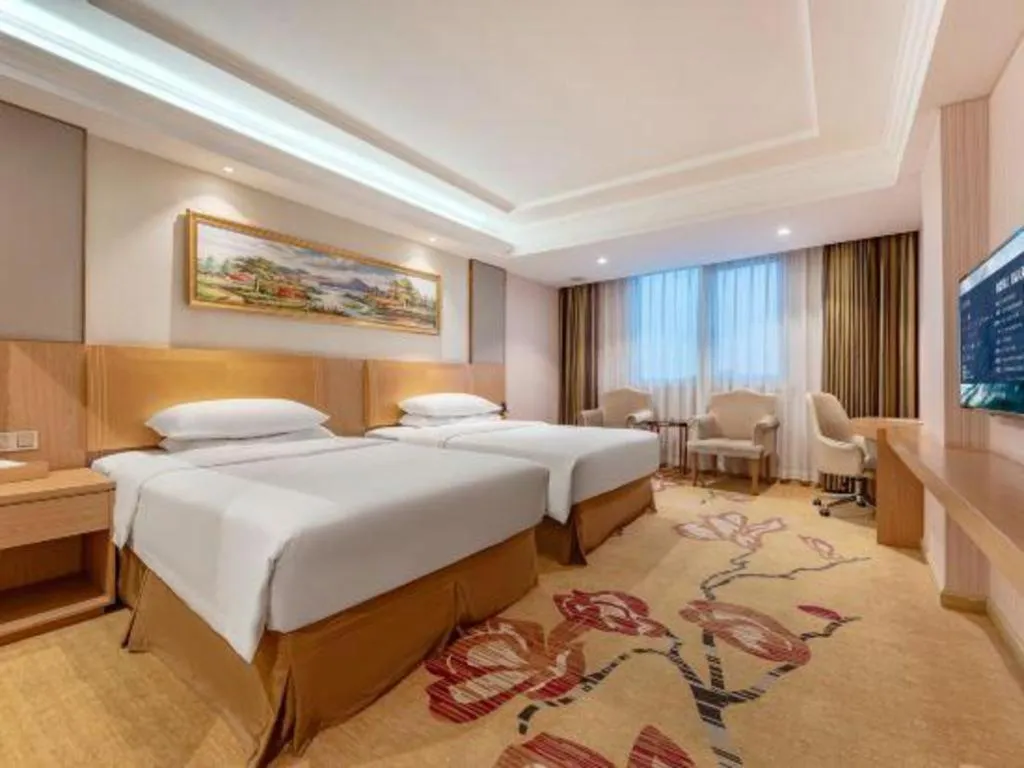 Bed in Vienna Hotel Guangzhou Baiyun Airport Huadu Avenue