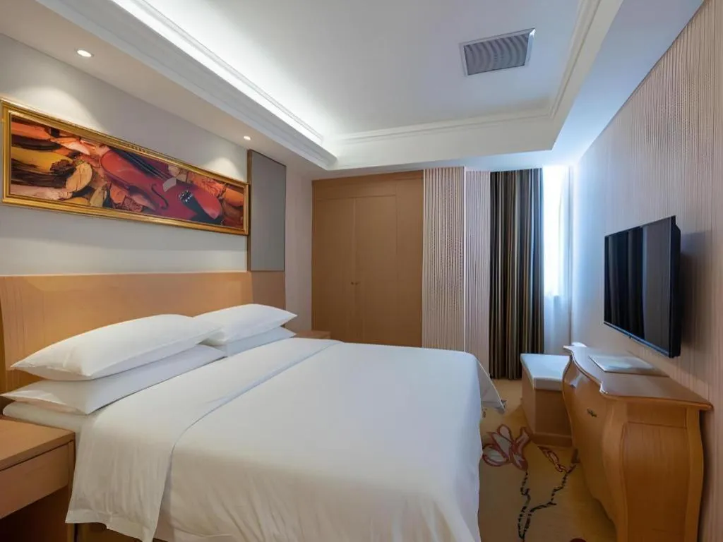Bed in Vienna Hotel Guangzhou Baiyun Airport Huadu Avenue