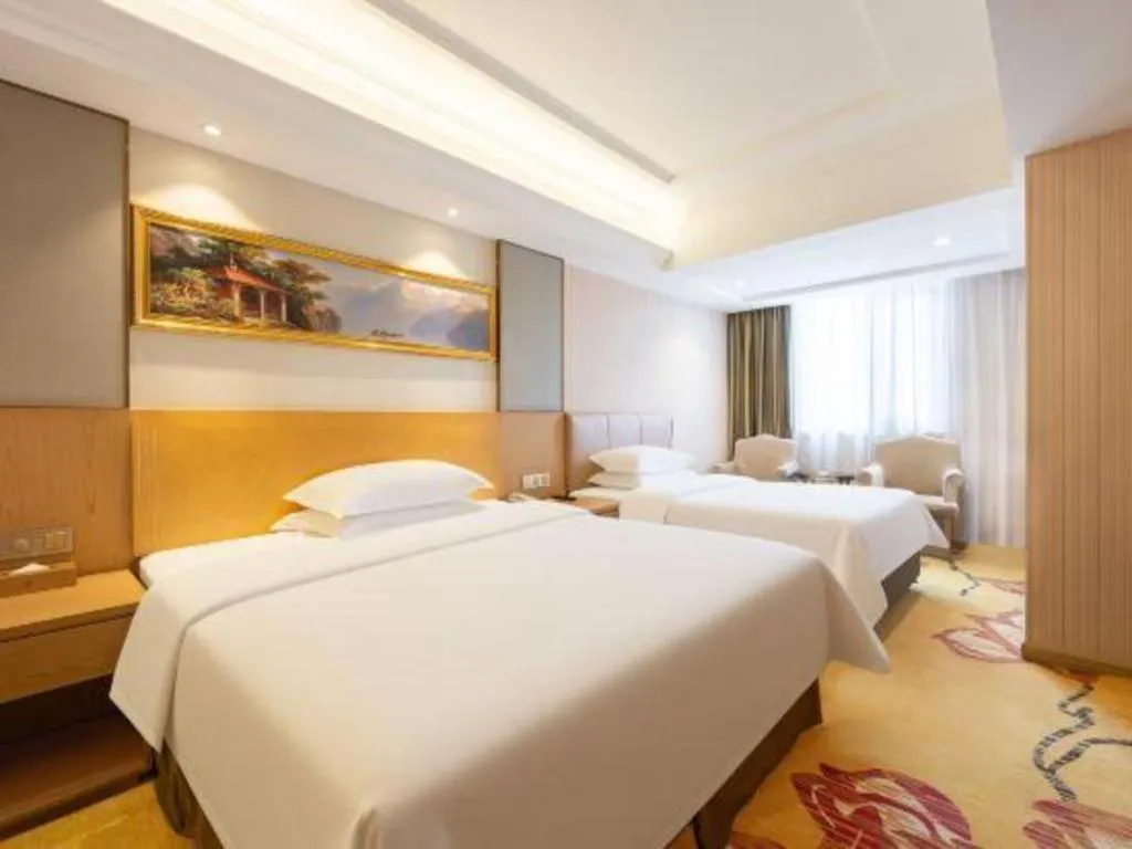 Bed in Vienna Hotel Guangzhou Baiyun Airport Huadu Avenue
