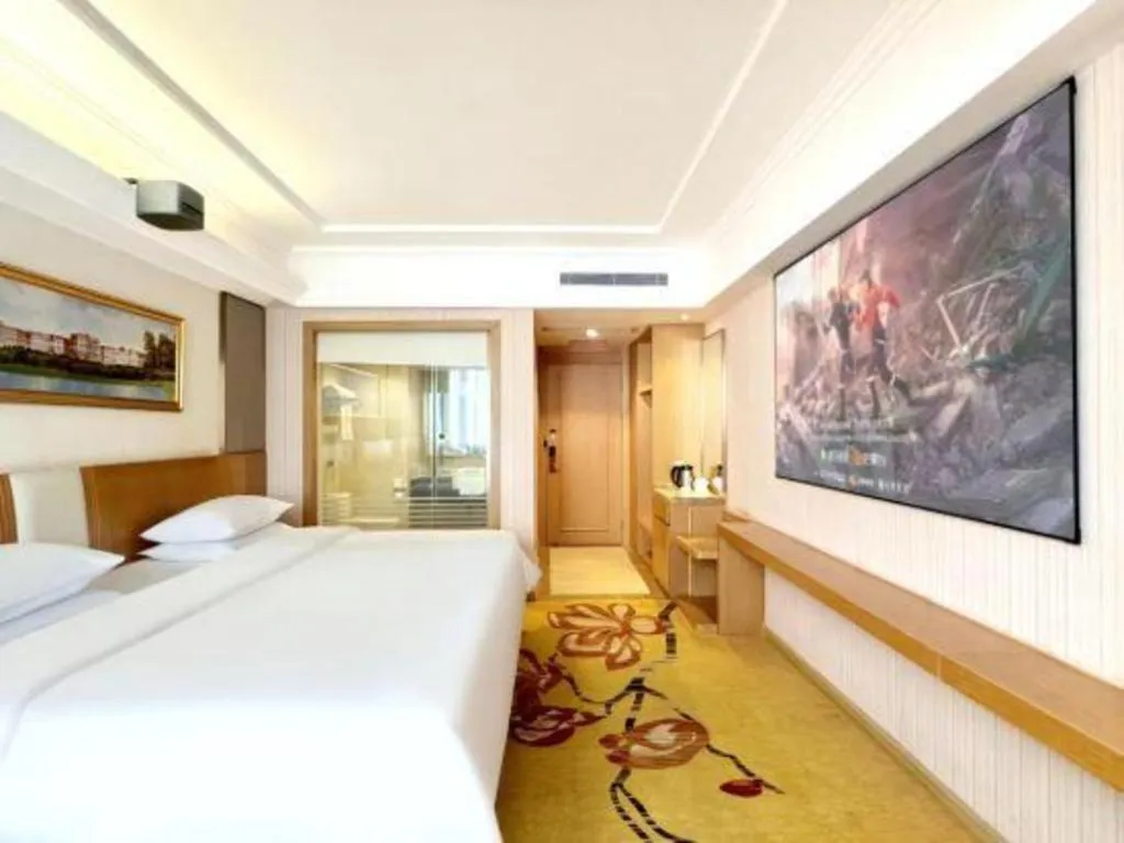 Bed in Vienna Hotel Guangzhou Baiyun Airport Huadu Avenue