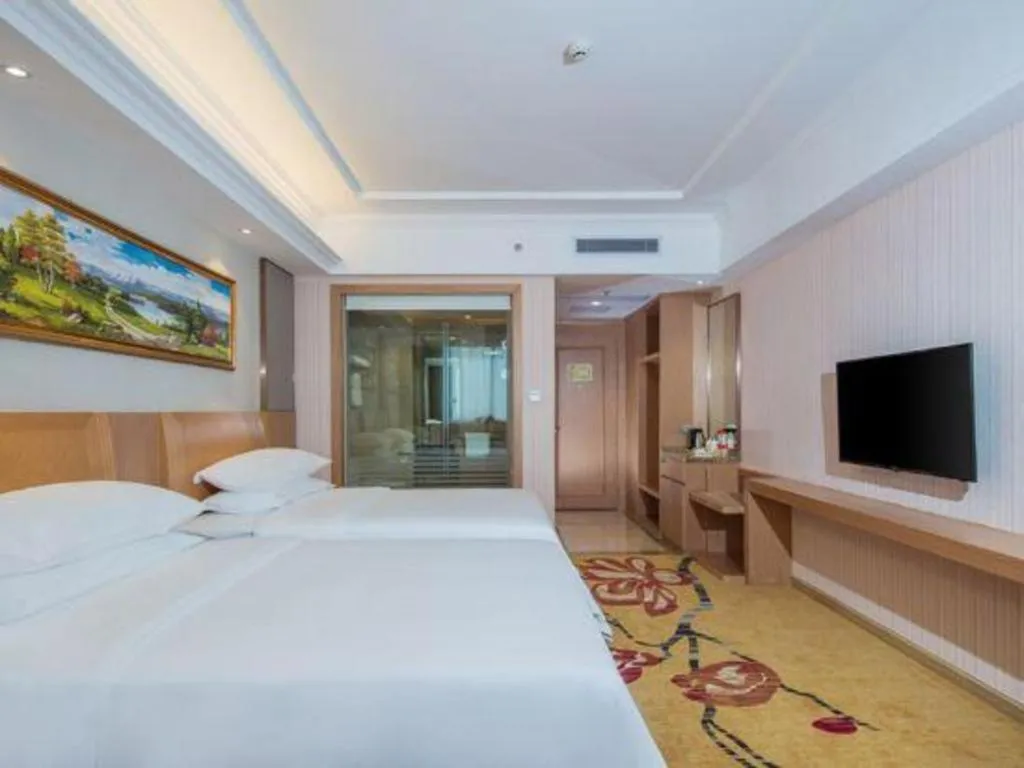 Bed in Vienna Hotel Guangzhou Baiyun Airport Huadu Avenue