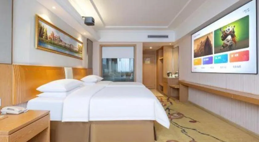 Bed in Vienna Hotel Guangzhou Baiyun Airport Huadu Avenue