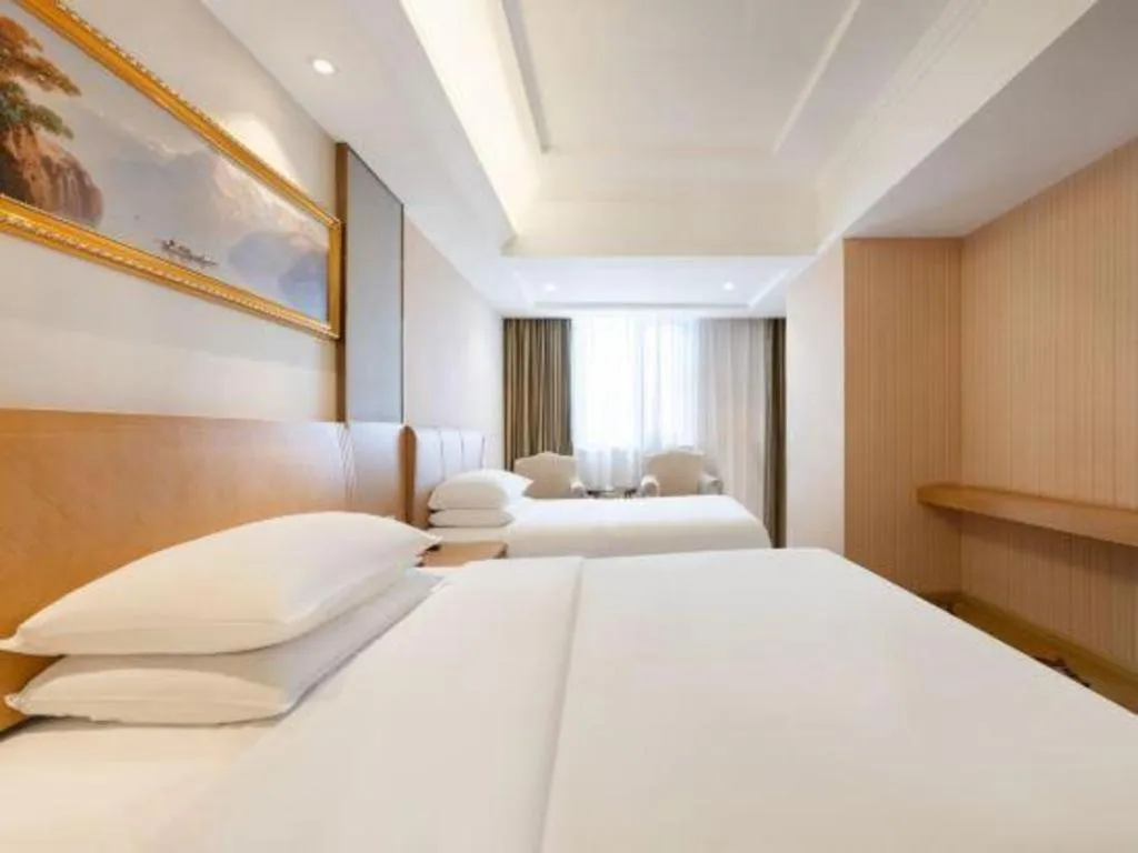 Bed in Vienna Hotel Guangzhou Baiyun Airport Huadu Avenue