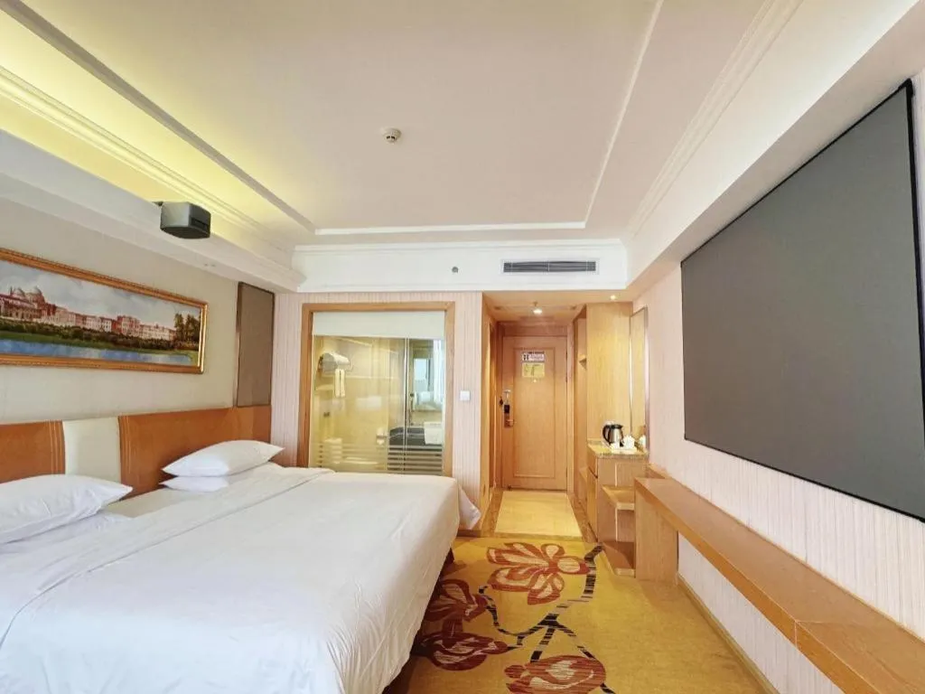 Bed in Vienna Hotel Guangzhou Baiyun Airport Huadu Avenue