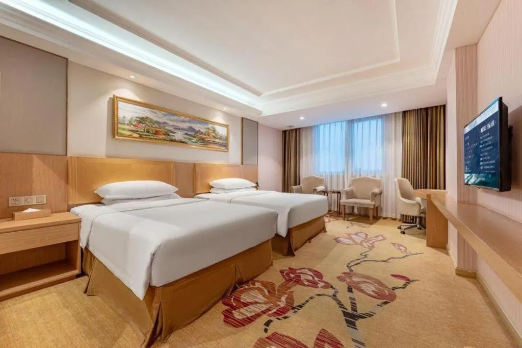 Bed in Vienna Hotel Guangzhou Baiyun Airport Huadu Avenue