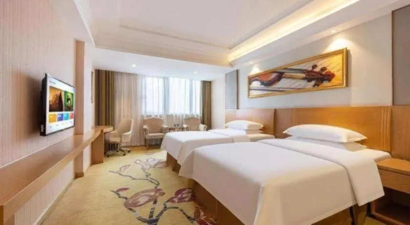 Bed in Vienna Hotel Guangzhou Baiyun Airport Huadu Avenue