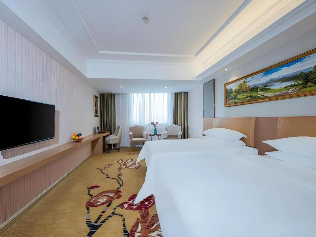 Bed in Vienna Hotel Guangzhou Baiyun Airport Huadu Avenue
