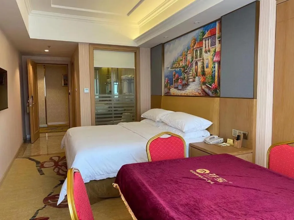 Bed in Vienna Hotel Guangzhou Baiyun Airport Huadu Avenue