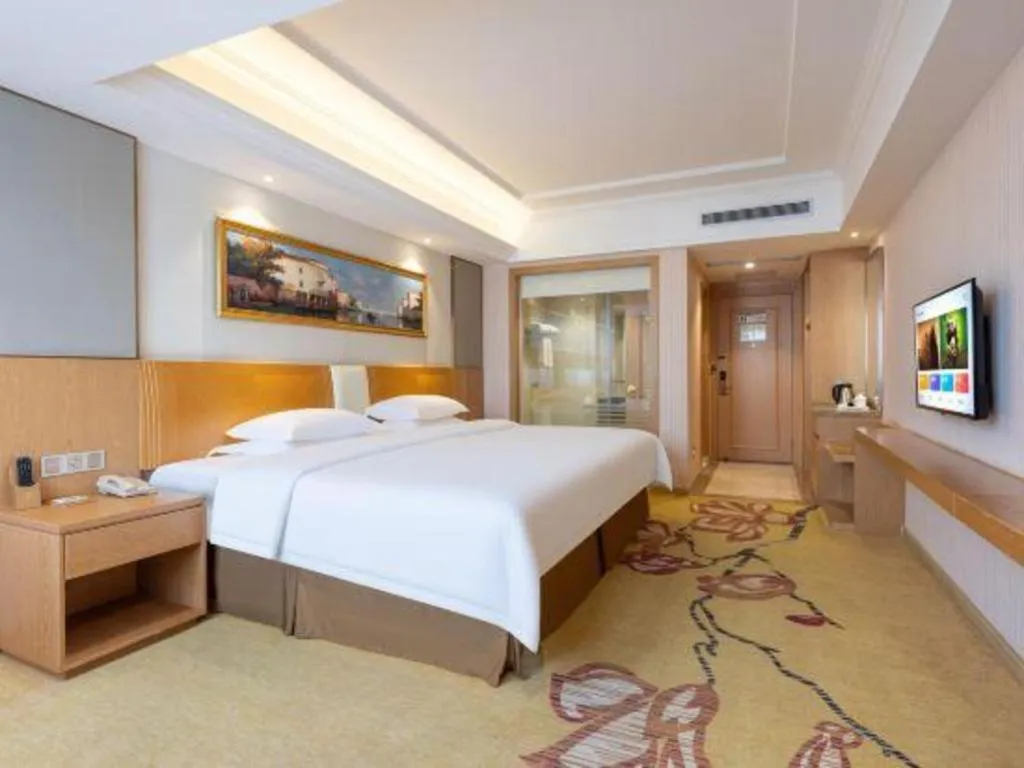 Bed in Vienna Hotel Guangzhou Baiyun Airport Huadu Avenue
