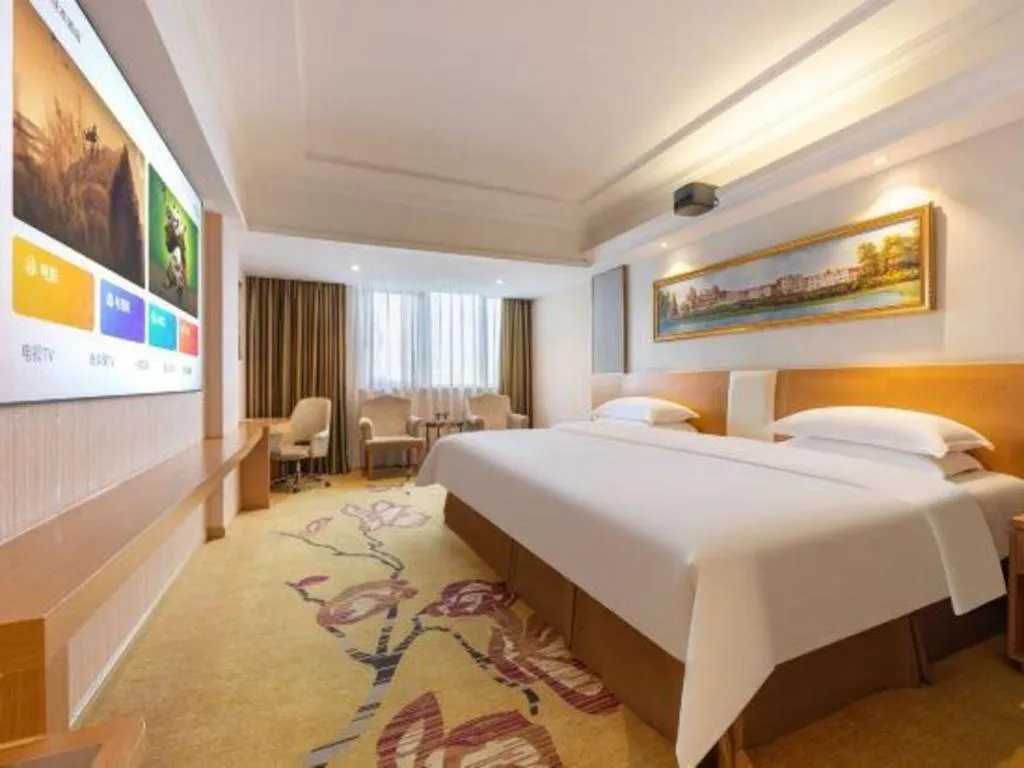 Bed in Vienna Hotel Guangzhou Baiyun Airport Huadu Avenue