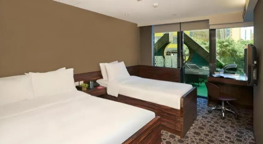 Bed in J Link Hotel