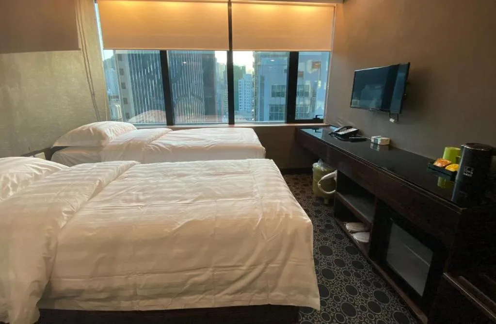 Bed in J Link Hotel