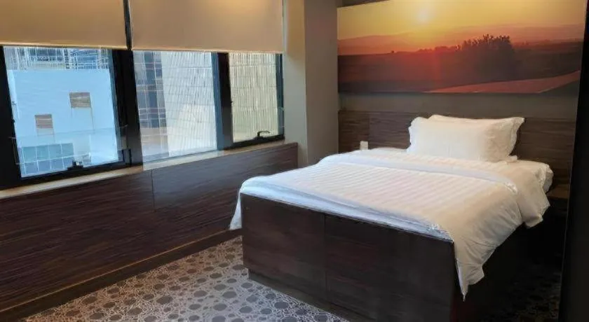 Bed in J Link Hotel