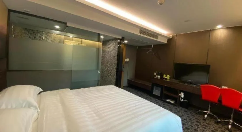 Bed in J Link Hotel