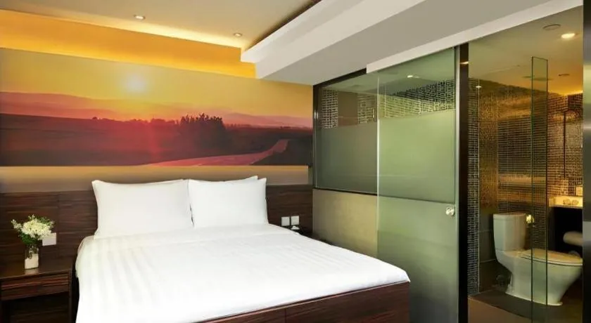 Bed in J Link Hotel