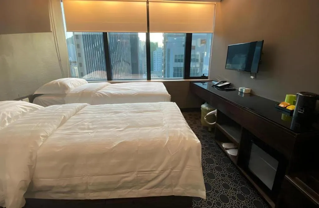 Bed in J Link Hotel