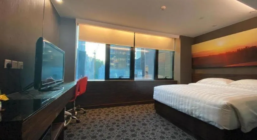 Bed in J Link Hotel