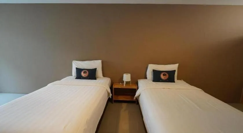 Bed in RoomQuest Chiang Mai Tha Sala