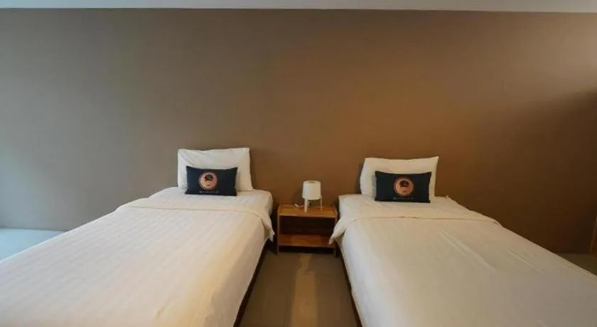 Bed in RoomQuest Chiang Mai Tha Sala