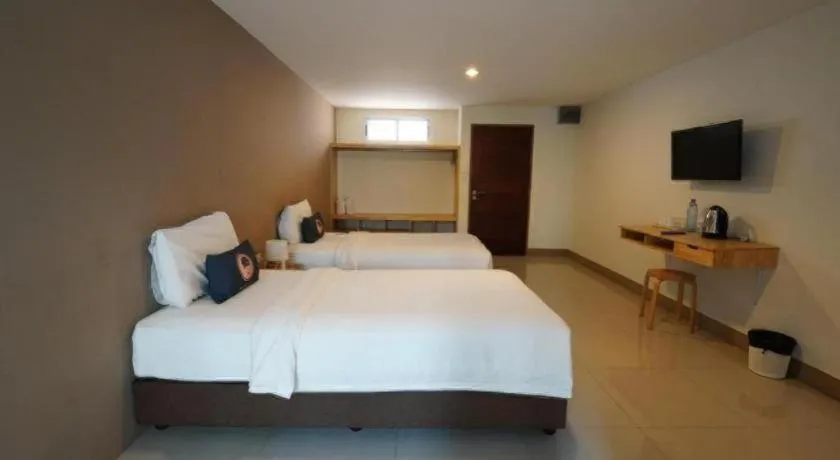 Bed in RoomQuest Chiang Mai Tha Sala