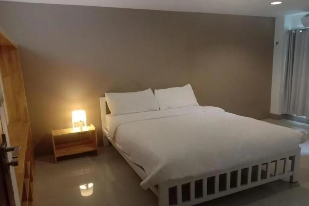 Bed in RoomQuest Chiang Mai Tha Sala