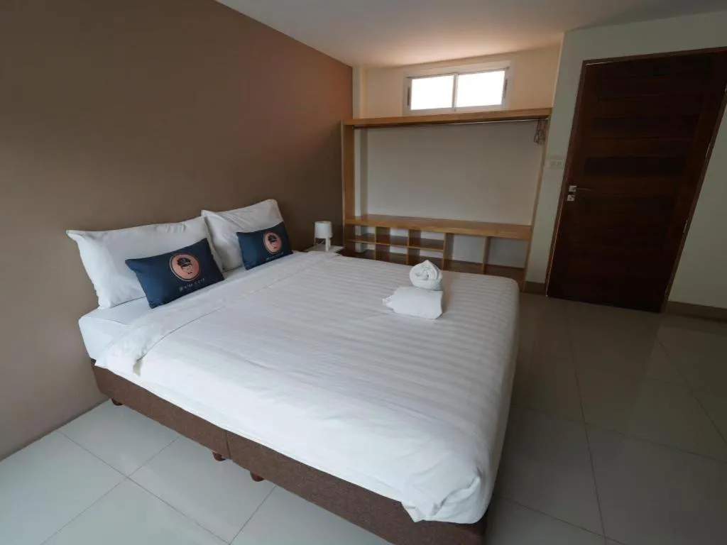 Bed in RoomQuest Chiang Mai Tha Sala