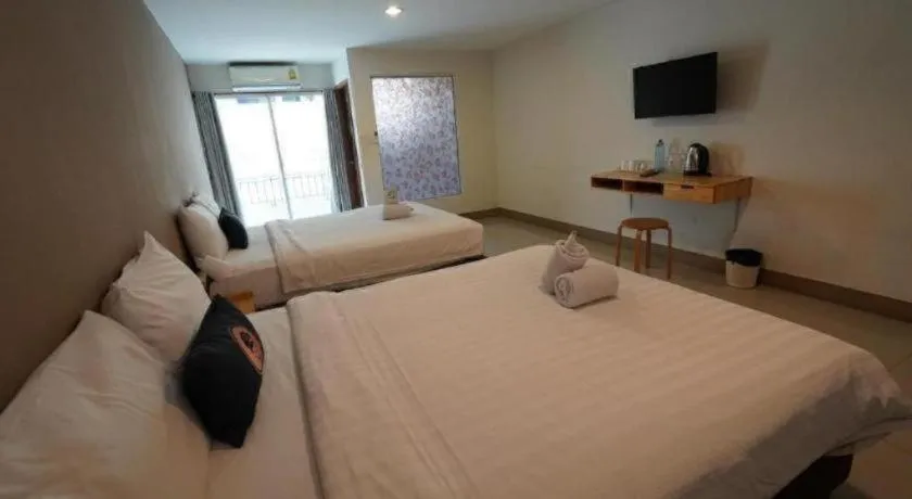 Bed in RoomQuest Chiang Mai Tha Sala