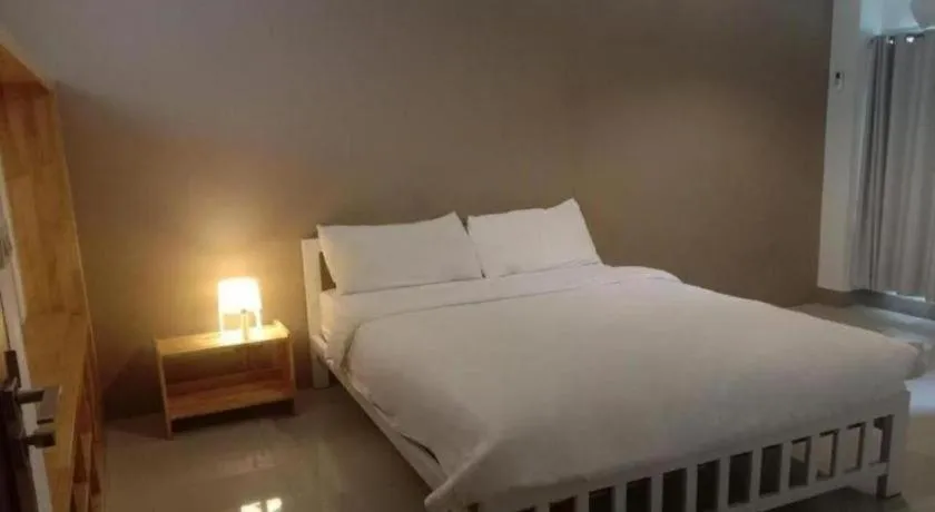 Bed in RoomQuest Chiang Mai Tha Sala